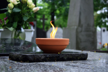 candle burning on cemetery